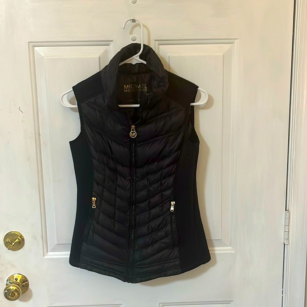 Michael Kors black lightweight puffer vest. It says XS but is really a S-M.